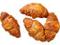Četri zeltaini brūni siera kruasāni uz melna fona