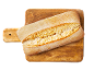 Ciabatta maize uz koka griešanas dēļa.