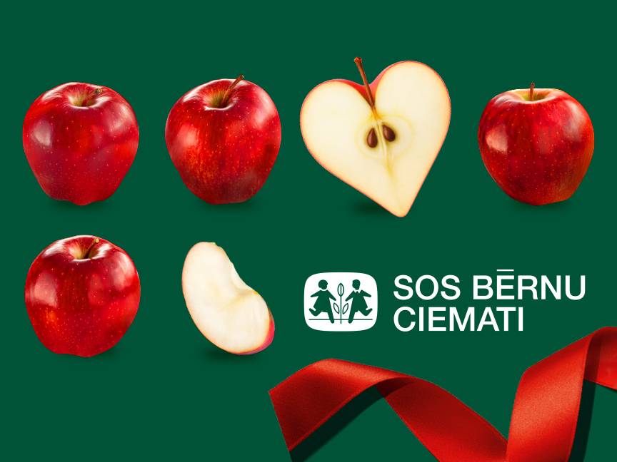 Красные яблоки, одно разрезано в форме сердца, и логотип SOS Bērnu ciemati на зеленом фоне.